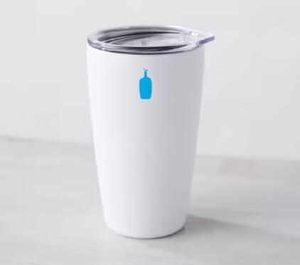 White travel mug with clear lid and bright blue Blue Bottle logo