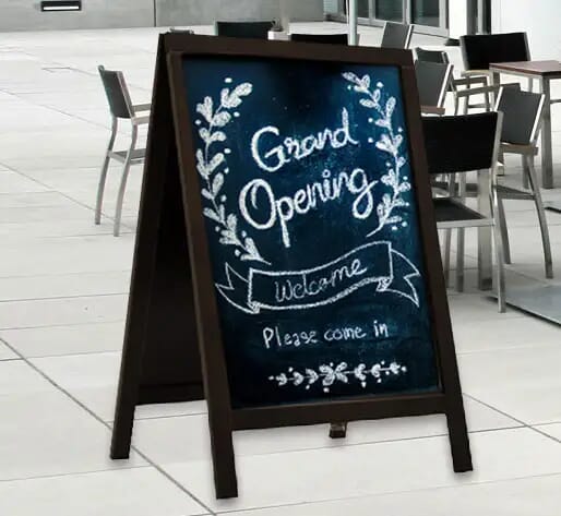 Grand opening chalkboard on sidewalk