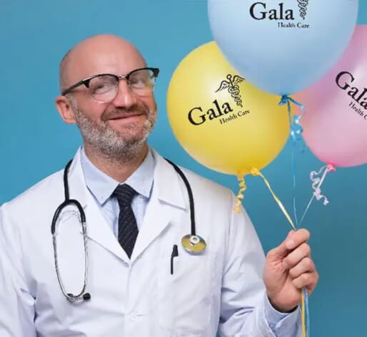 doctor holding balloons for hospital event