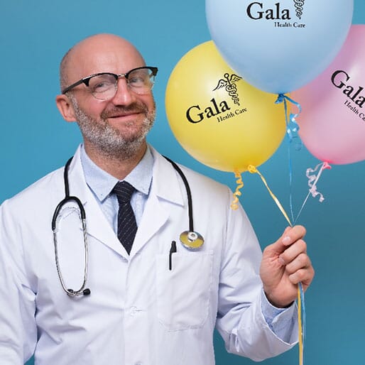 doctor holding balloons for hospital event