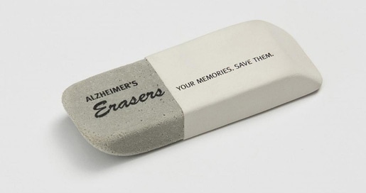 White and gray eraser printed with the words: Alzheimer's Erasers. Your Memories. Save them.