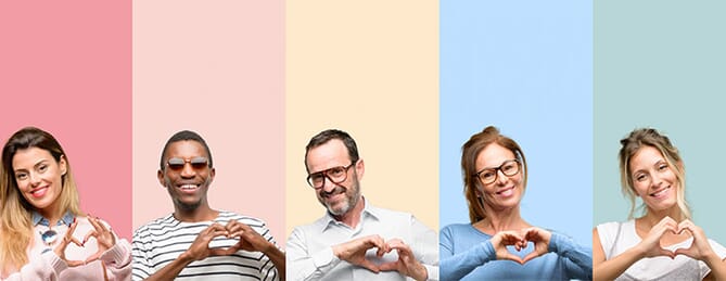 People making heart shape with hands