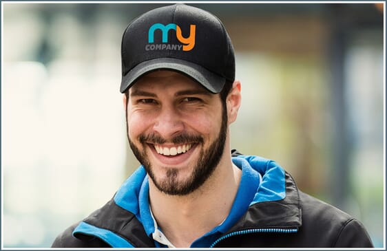 Man wearing hat with corporate logo