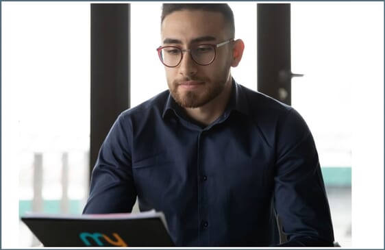 Man looking at a customized notebook