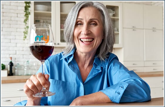 Woman holding up customized wine glass