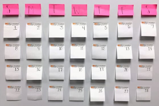 Sticky note calendar on white board