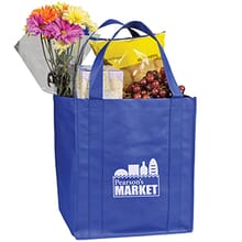 Royal blue grocery tote with food and flowers