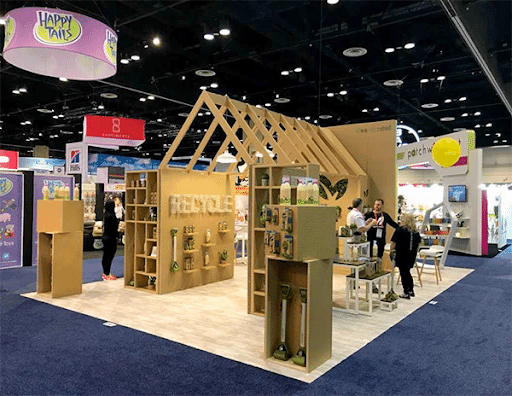 Wooden trade show booth with recycle sign for the company Earth Rated