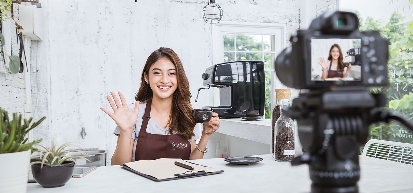 Woman recording video to advertise business