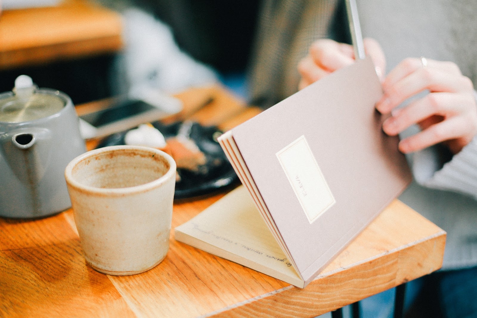 notebook and coffee cup