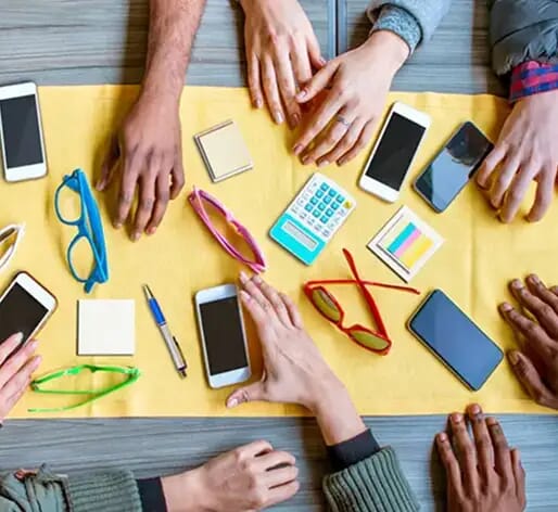 group of friends with tech items