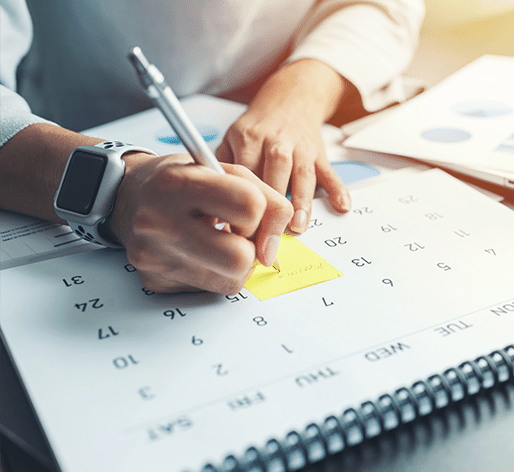 using calendar and planner on desk