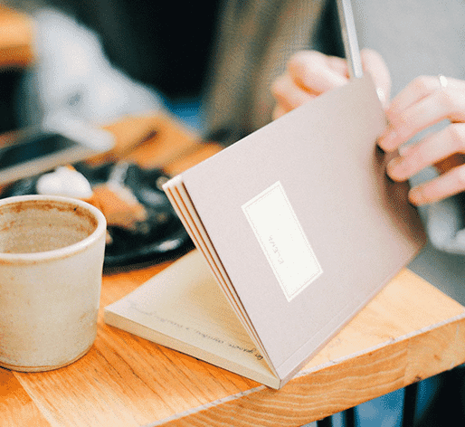 Woman writing in notebook