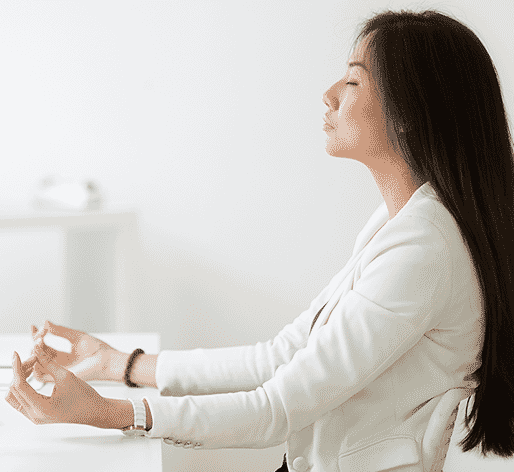 Woman meditating in office