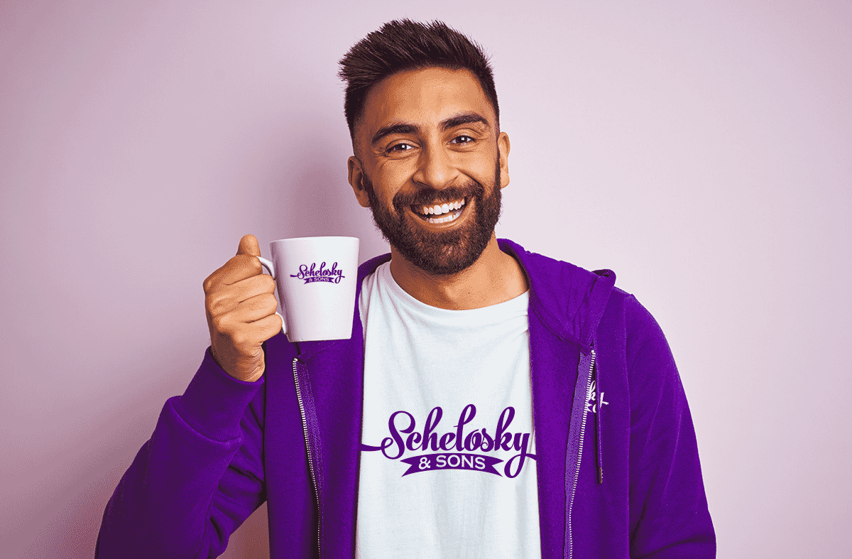 Man happy holding promo mug and wearing promo apparel