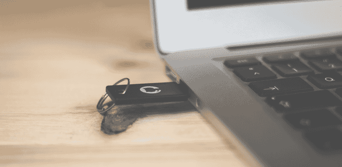 Sleek black USB in macbook