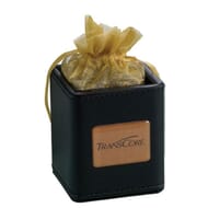 Black faux leather square pencil cup with debossed logo filled with a plastic bag of chocolate covered almonds