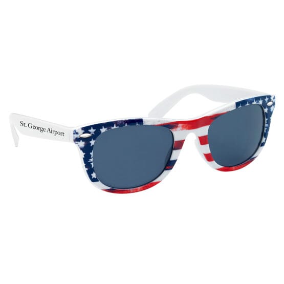 White wayfarer sunglasses with red, white and blue American flag print and black text logo.