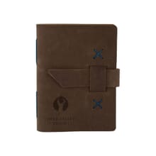 Dark brown leather journal with debossed logo and strap closure