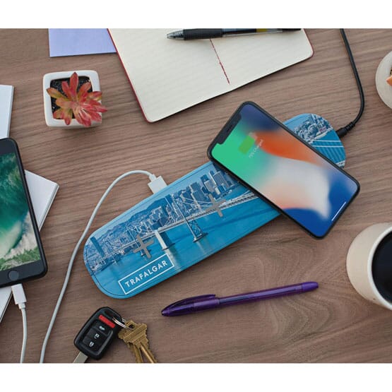 Qi charger with phone on desk
