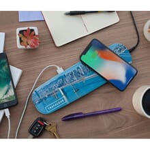 Qi charger with phone on desk