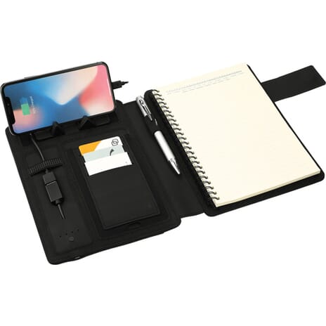 Dark gray notebook and wireless charging station